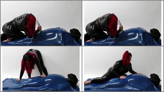 Bondage – Mistress Wearing Latex Torturing Trapped Slave in Rubber Vacuum Bed