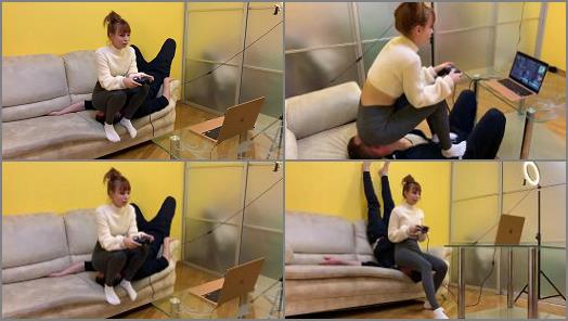 Petite Princess FemDom  Gamer Kira in Leggings Uses Her Chair Slave While Playing preview